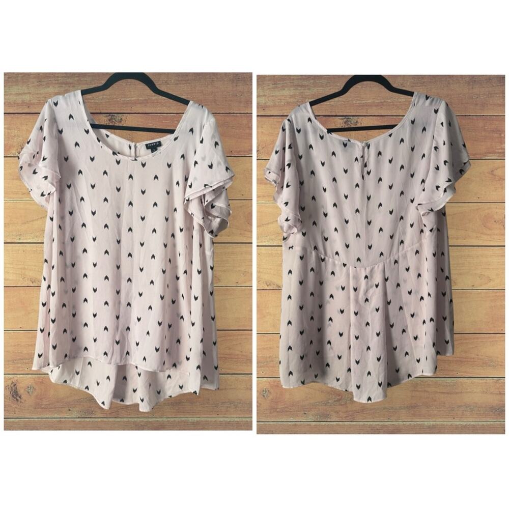 Torrid arrow like print tunic top with flared back